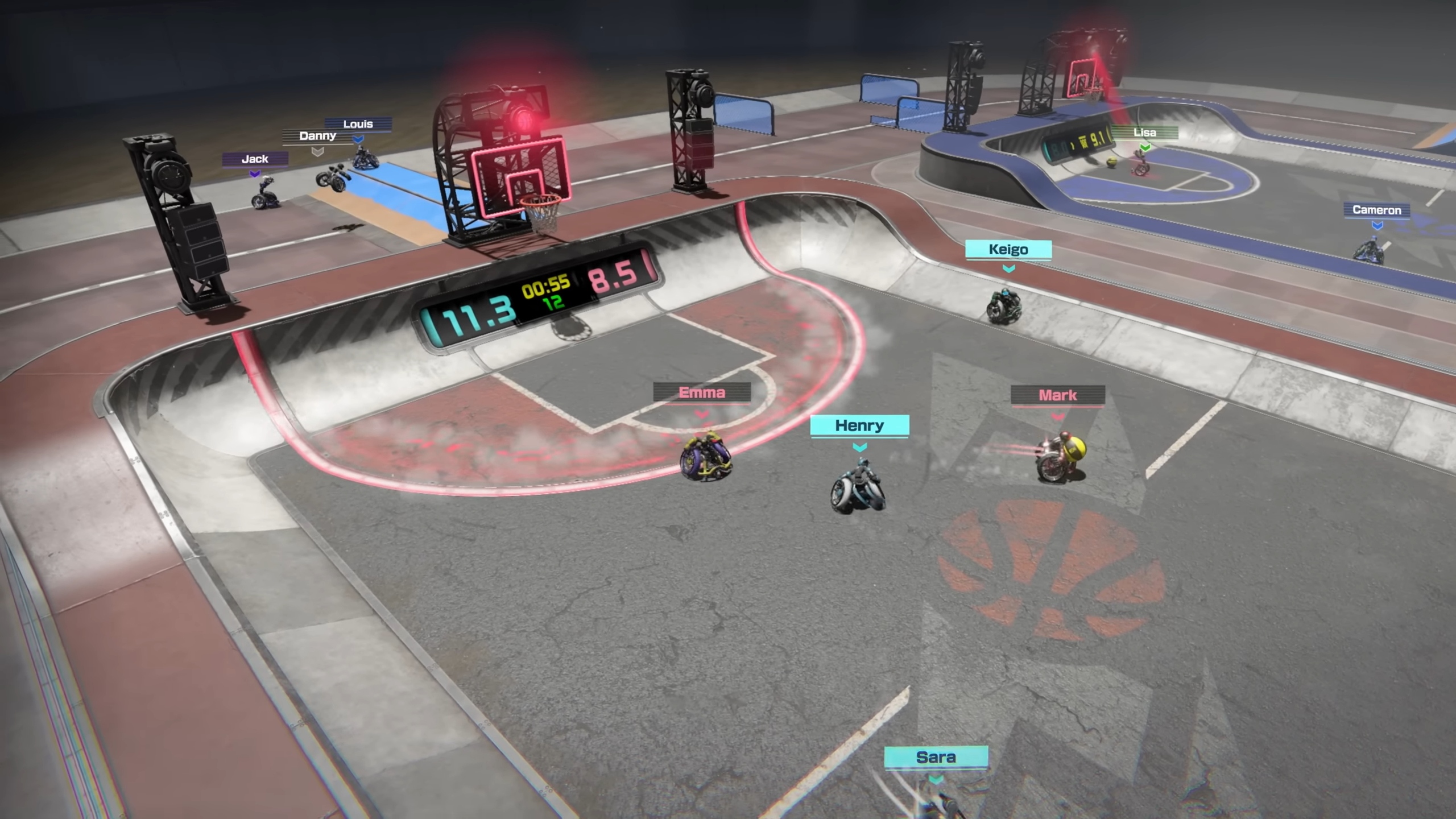 Screenshot of the Drag x Drive trailer from the Nintendo Switch 2 Direct. An overhead view shows a 3v3 going on in the left red court, while the right blue court has 2 players not engaged in a match playing with a ball, and the track going around the court has 2 more players sitting by a ramp watching a third player spin around midair.